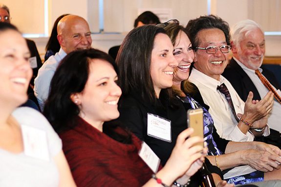 Karen Bordeleau, third from right, enjoys the awards ceremony with her guests and others in the audience. Bordeleau, retured executive editor and senior vice president of The Providence (R.I.) Journal, received the Judith Vance Weld Brown Award during the ceremony.