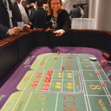 Kristen Braley, Stowe Reporter, tries craps table.