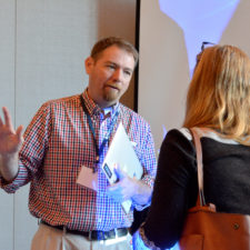 Tim Schmitt talks with one of the participants in his workshop