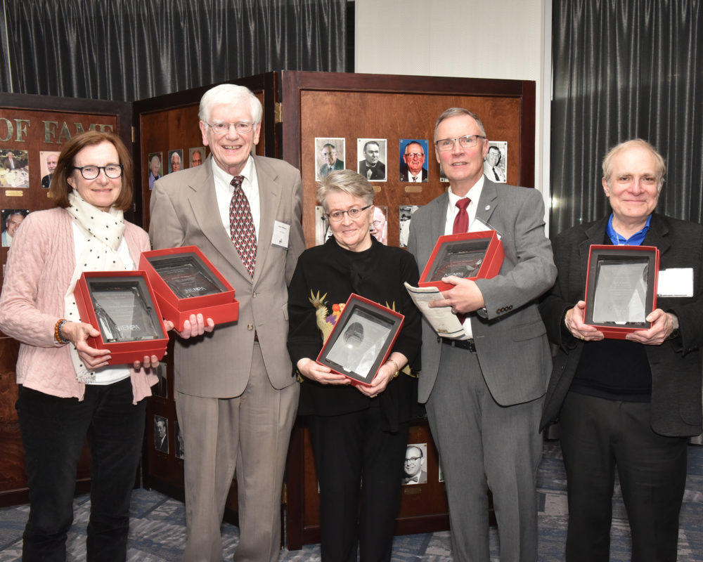 Hall of Fame Inductees. Left to rt: Mary Murphy representing her late husband W. Zachary (Bill) Malinowski, John Widdison, Pamela Heinrich MacPherson representing her father Frank Heinrich, Joseph W. McQuaid, and Bob Katzen at the New England Newspaper Convention, 2019.